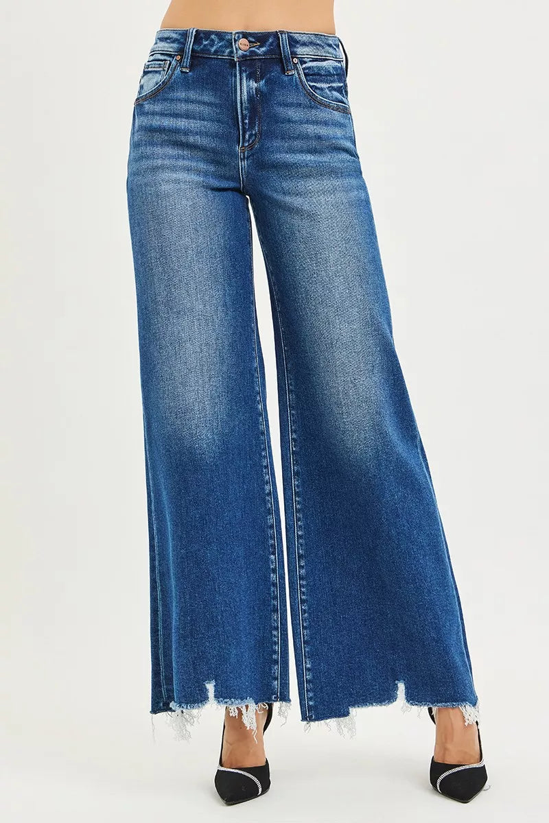 Blue wide-leg jeans on a white background