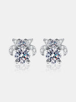 Turtle-shaped earrings with clear gemstones on a white background