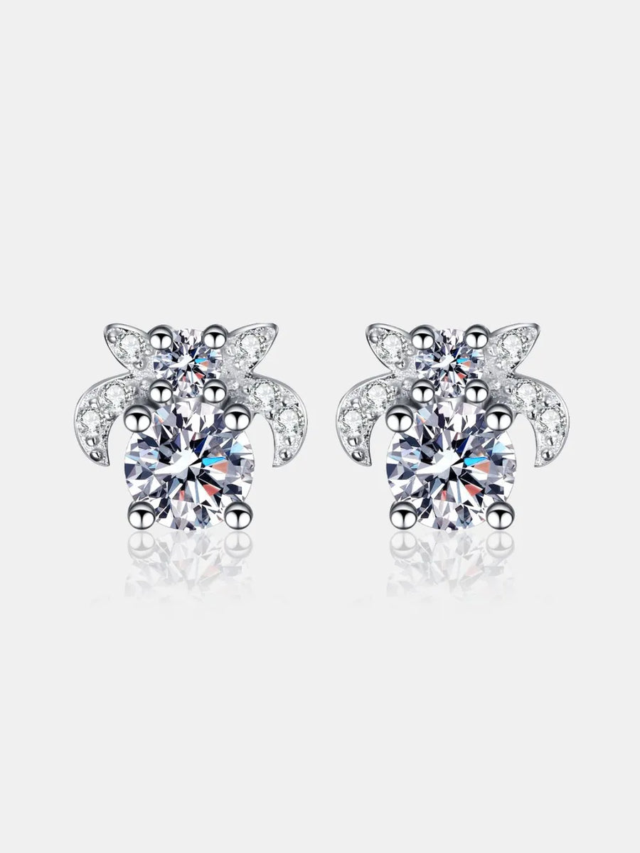 Turtle-shaped earrings with clear gemstones on a white background