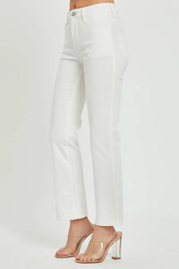 White pants worn by a person on a light gray background
