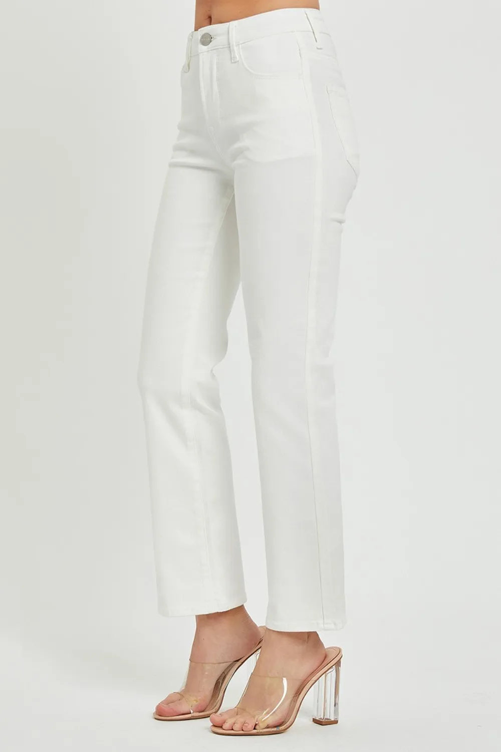 White pants worn by a person on a light gray background