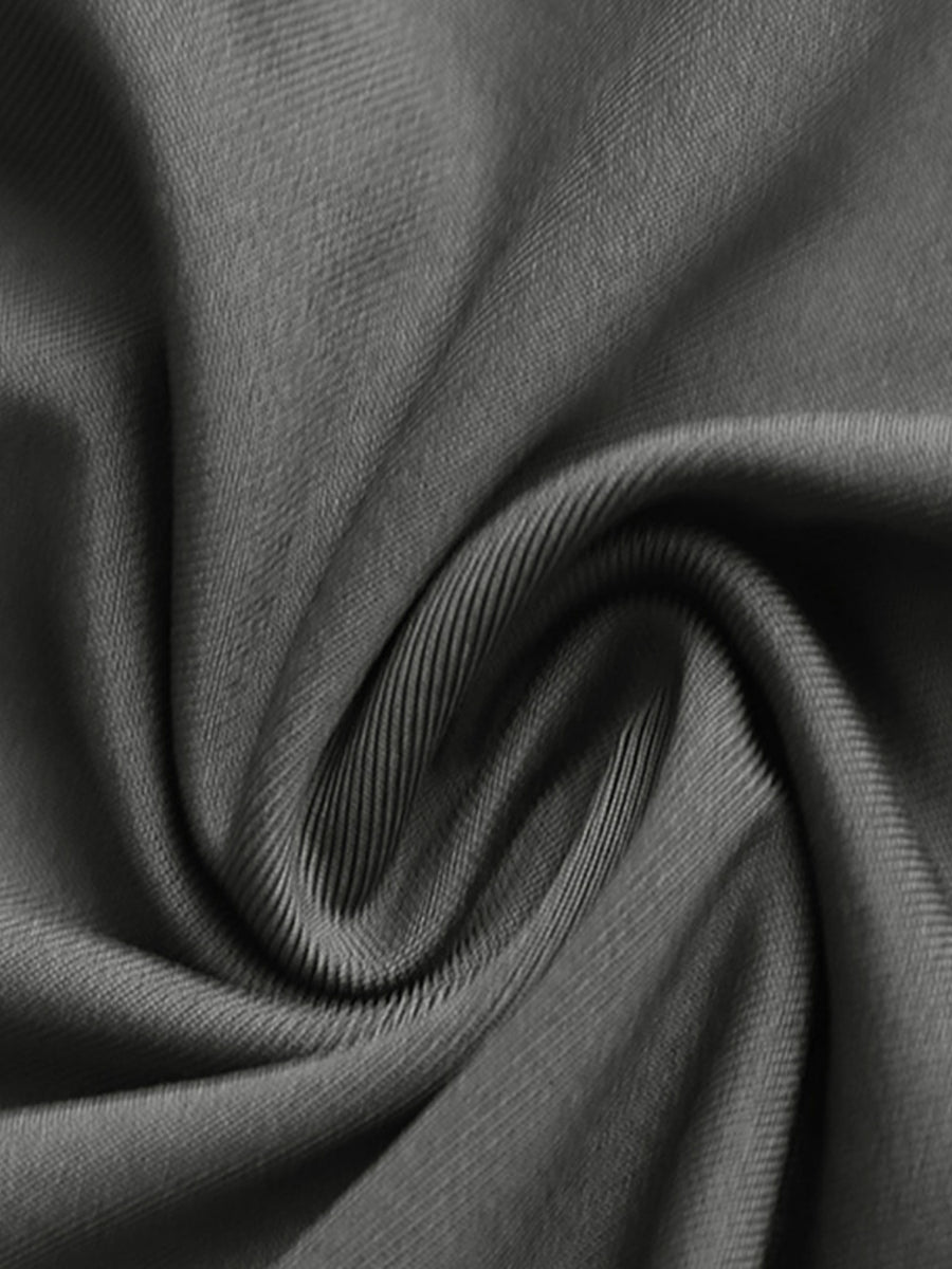 Close-up of dark gray fabric with folds
