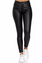 Black leather pants worn by a person on a white background