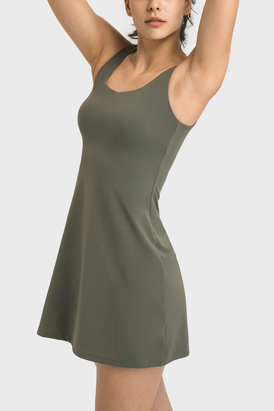 Woman wearing a green dress against a white background