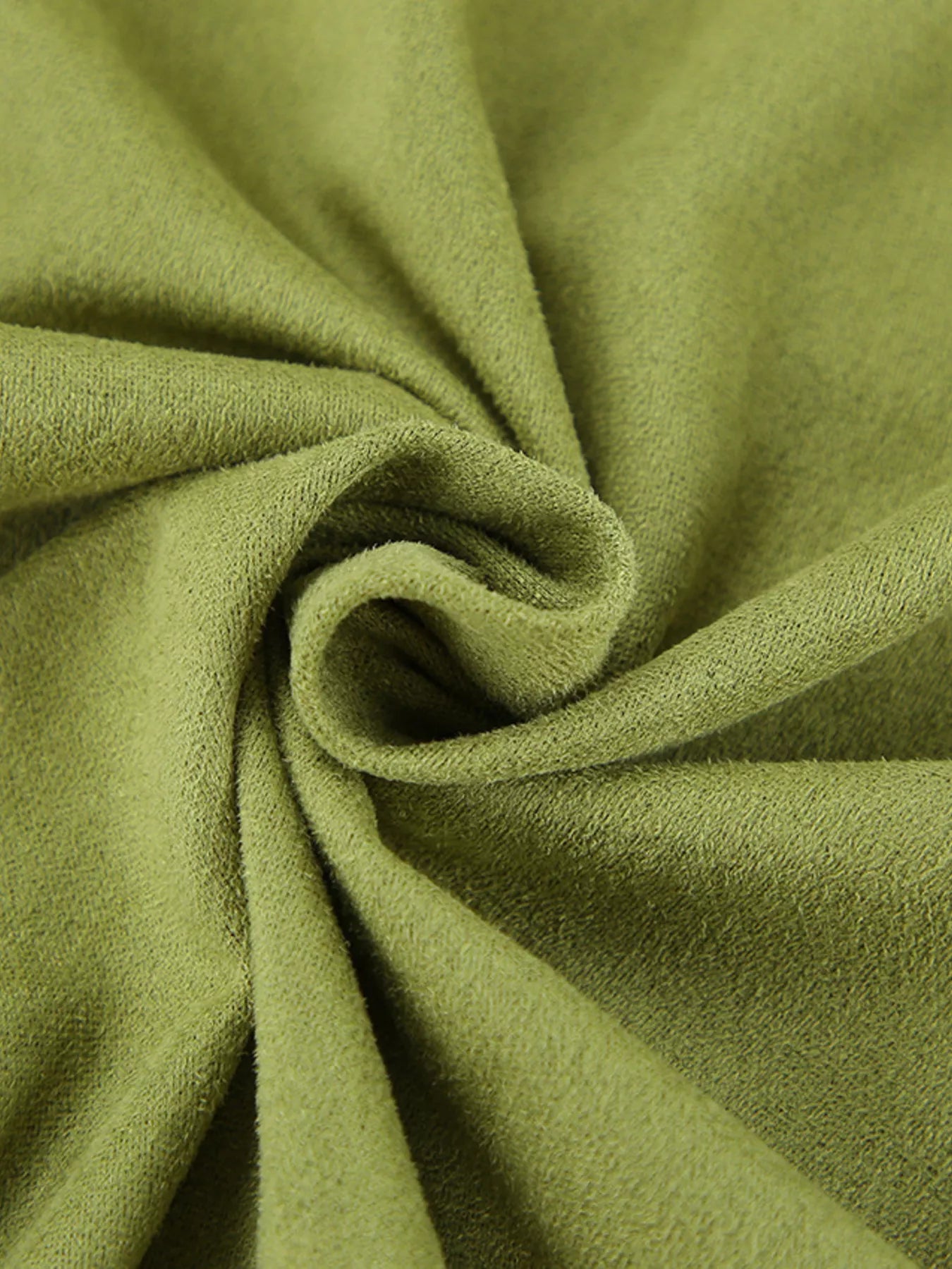 Close-up of green fabric with folds