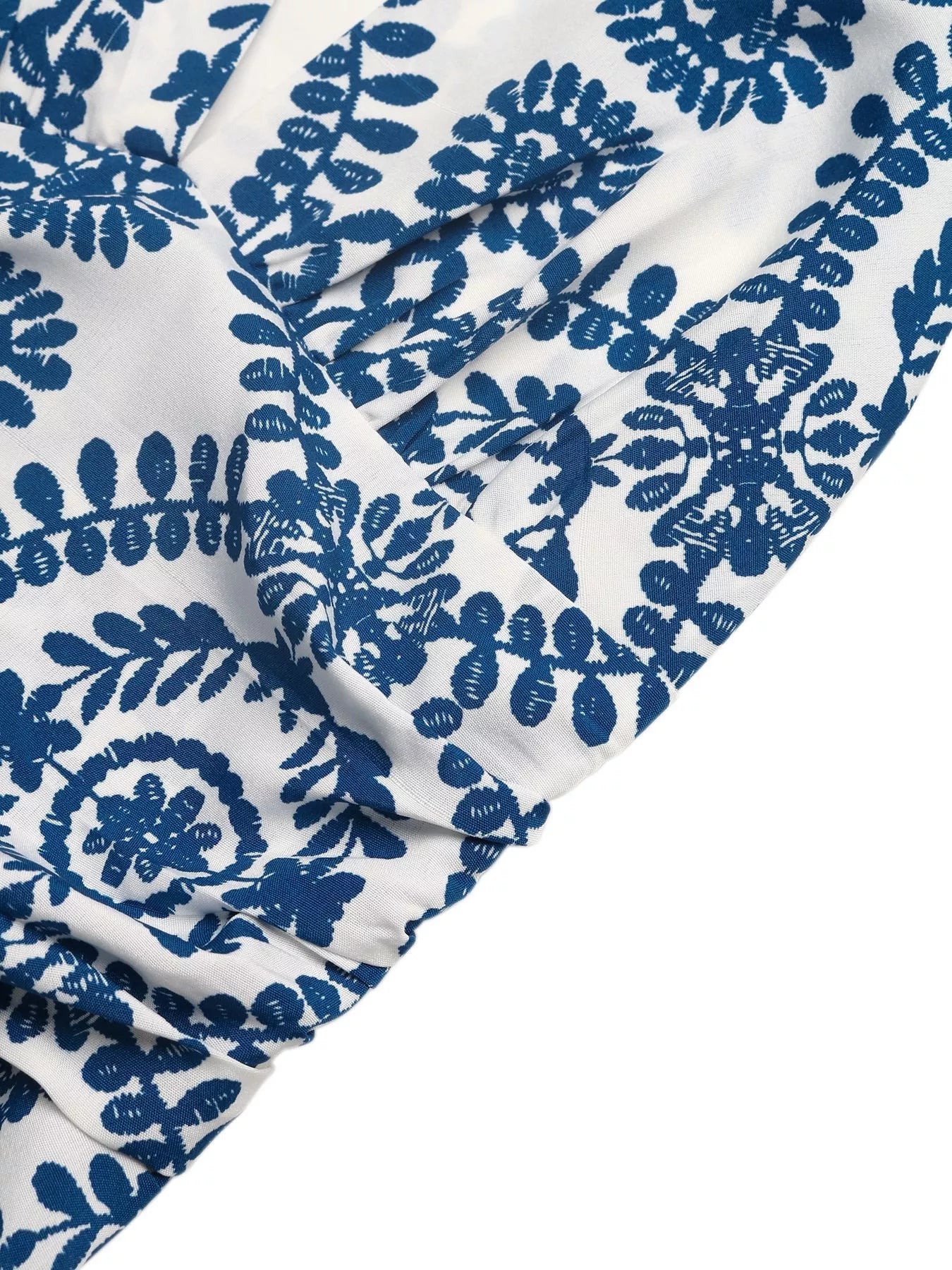 White fabric with blue floral patterns