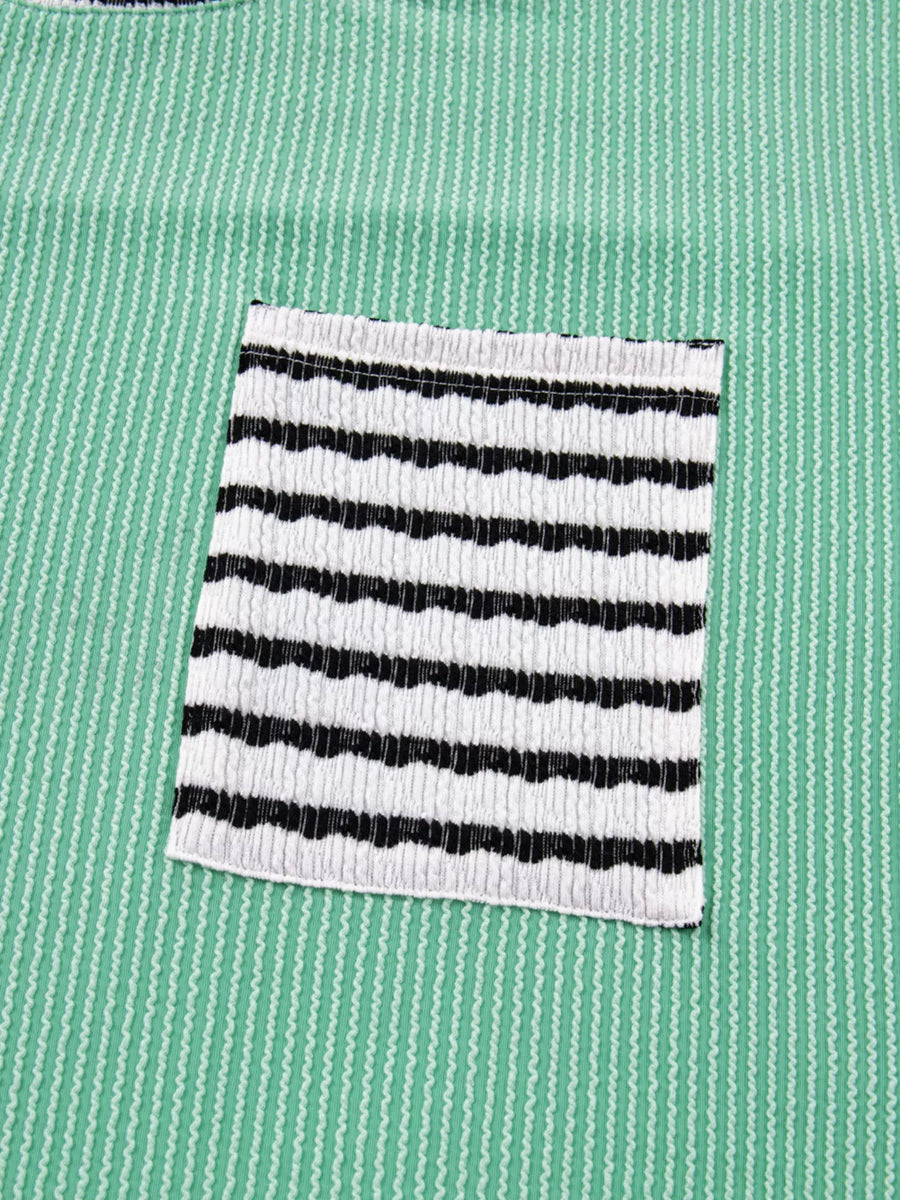 Black and white striped pocket on a green shirt