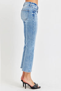 Light blue jeans worn by a person on a white background