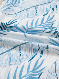 Close-up of blue leaf pattern fabric on a white background
