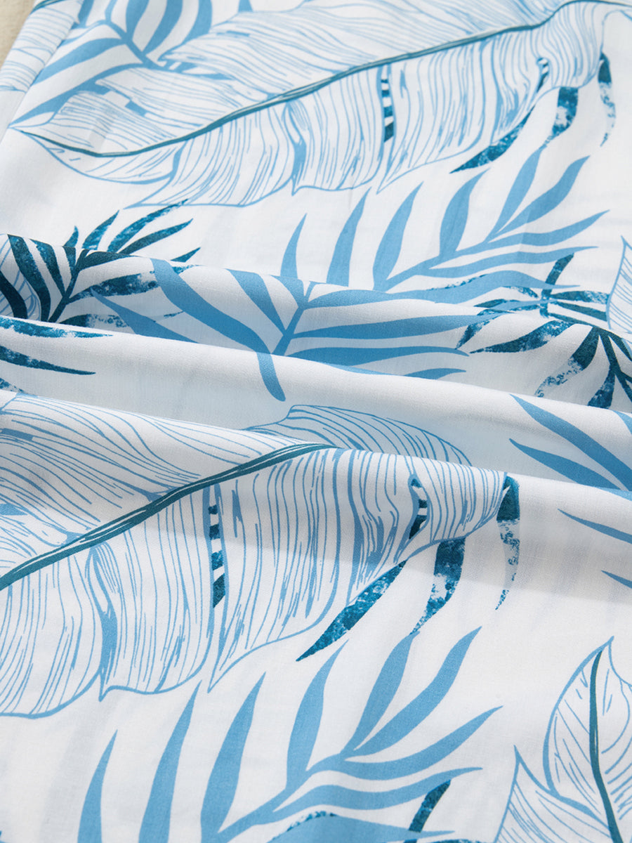 Close-up of blue leaf pattern fabric on a white background