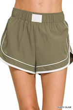 Olive green shorts with white trim on a white background