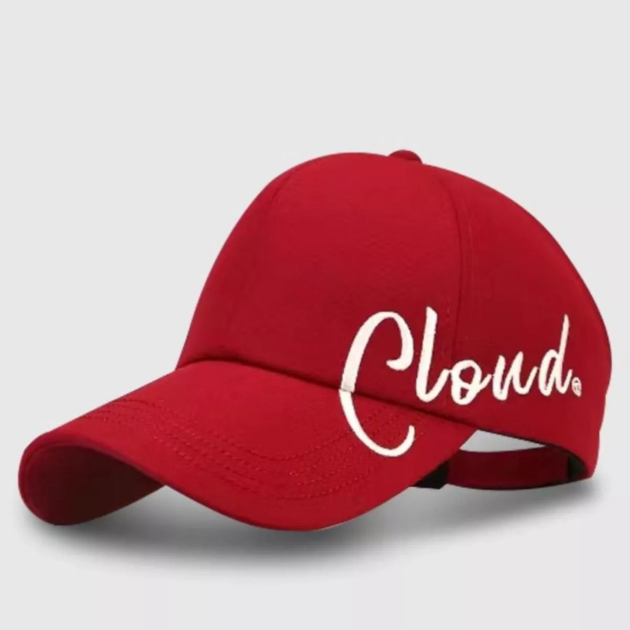 Red cap with 'Cloud' written on it against a light gray background