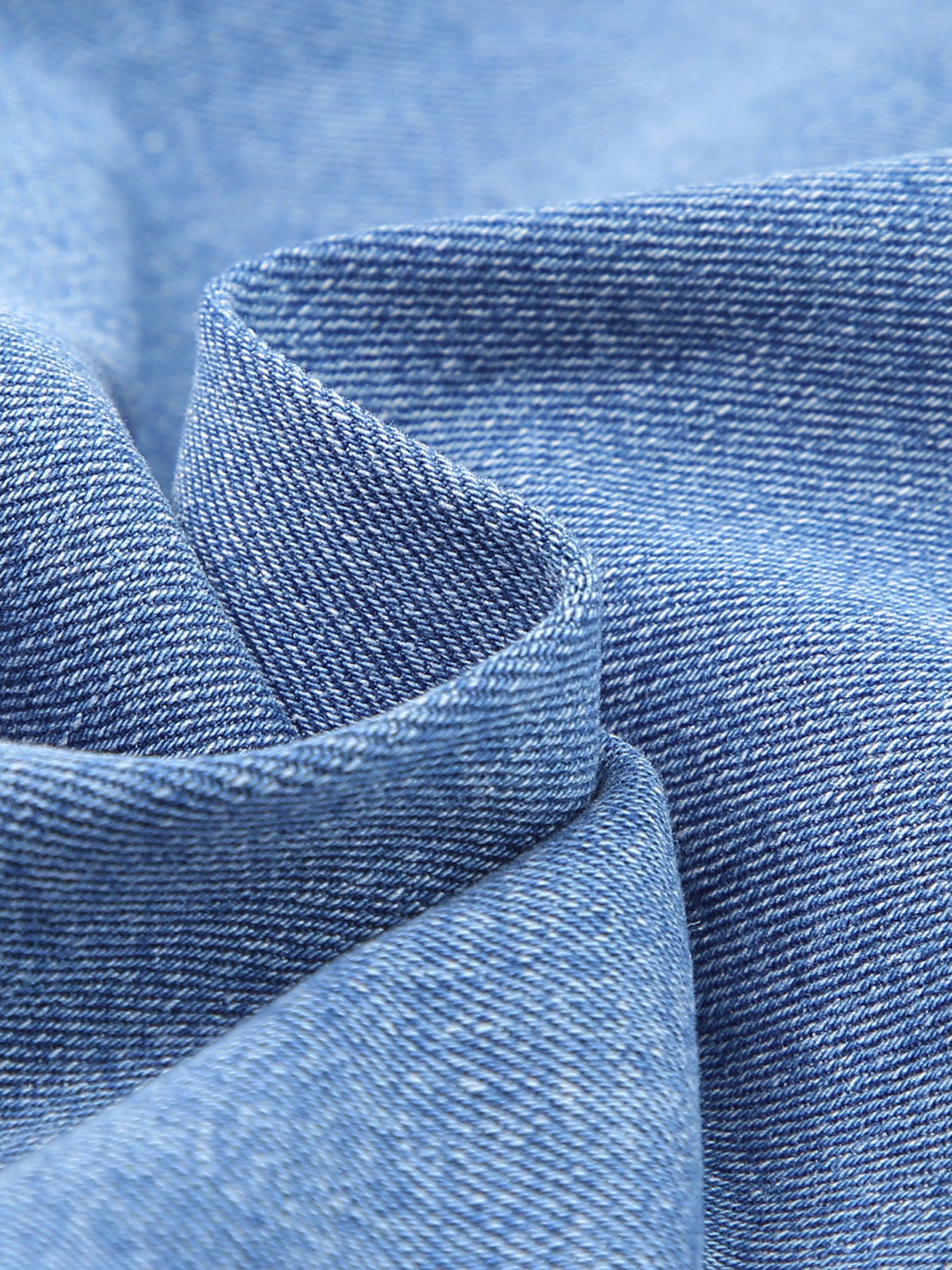 Close-up of blue denim fabric with a blurred background