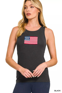 Woman wearing a black tank top with an American flag design on a white background