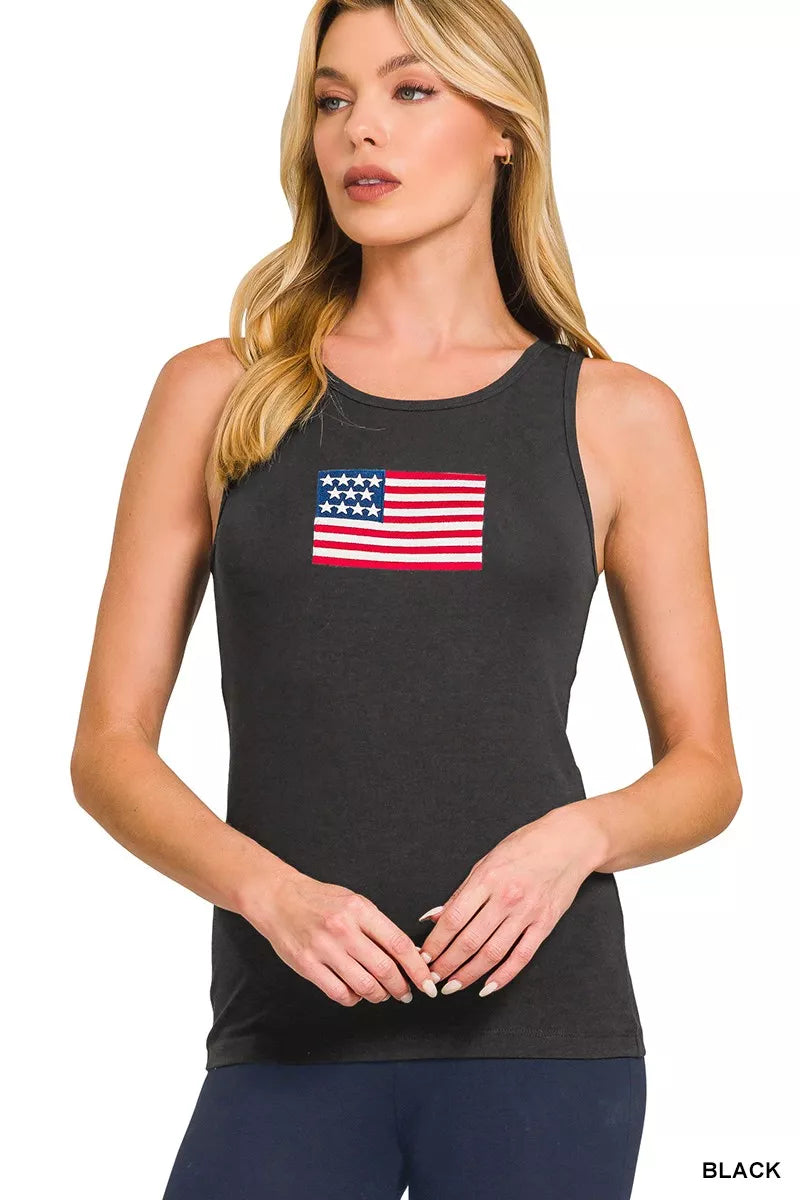 Woman wearing a black tank top with an American flag design on a white background