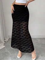 Person wearing a black lace skirt with a white top against a neutral background