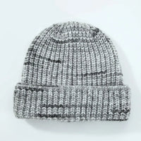 Knitted beanie with gray and black pattern on a white background