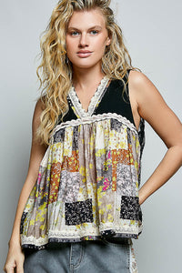 Woman wearing a sleeveless, patchwork top with a neutral background