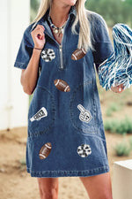 Woman wearing a denim dress with various patches outdoors