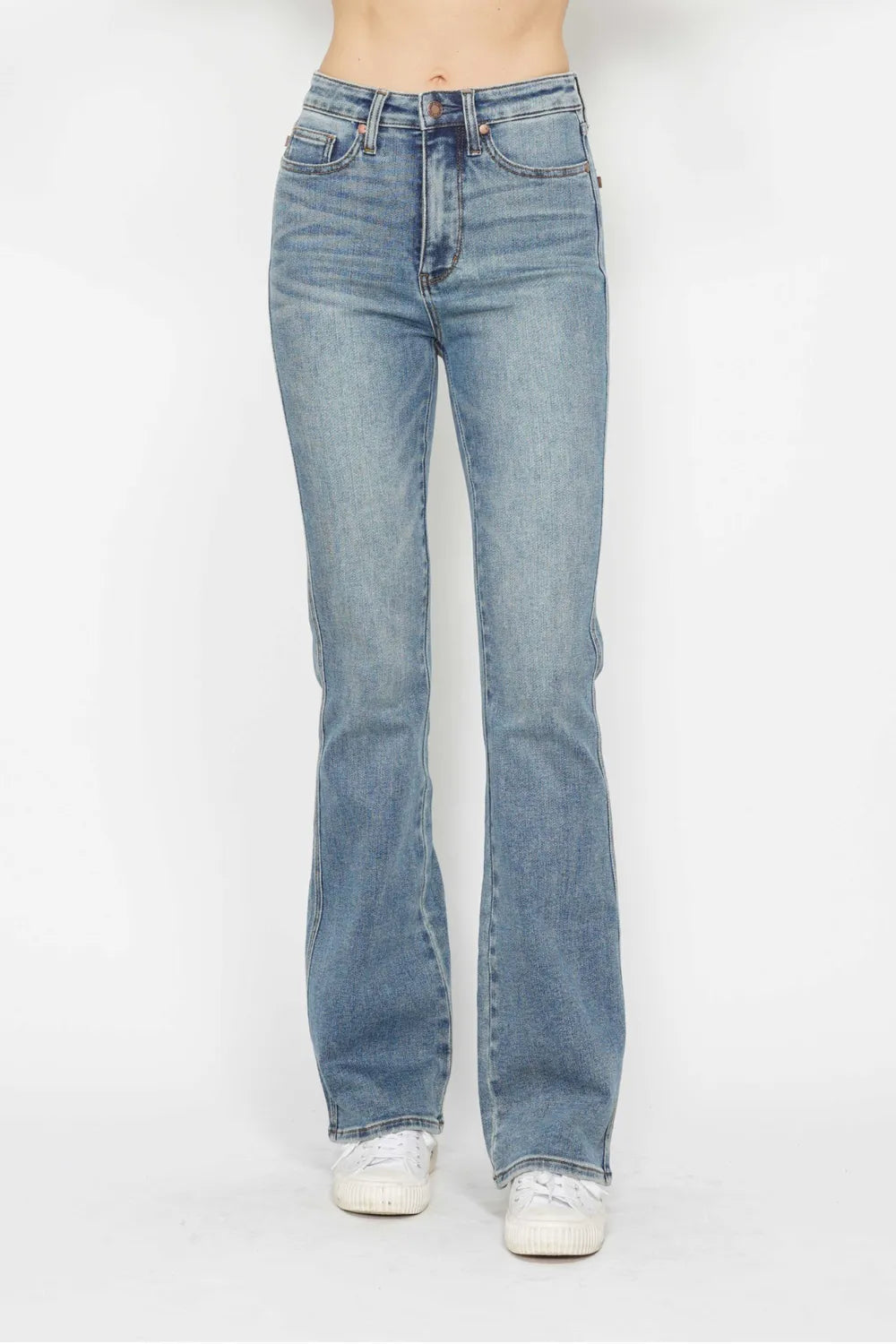 Light blue jeans worn by a person on a white background