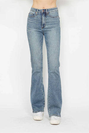 Light blue jeans worn by a person on a white background
