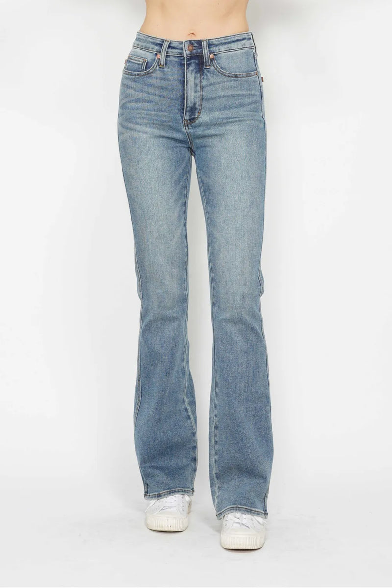 Light blue jeans worn by a person on a white background