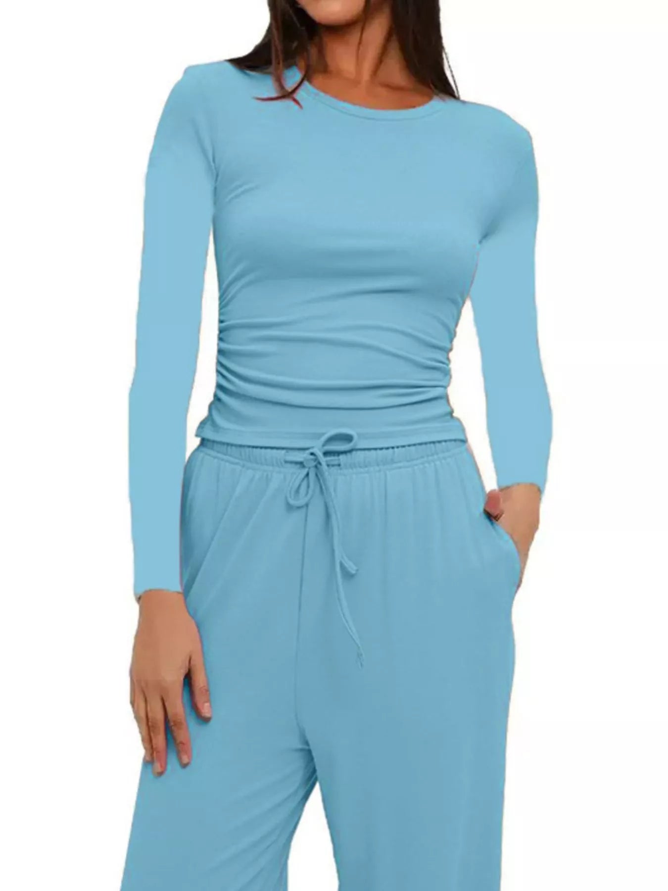 Light blue long-sleeve top and pants set on a white background