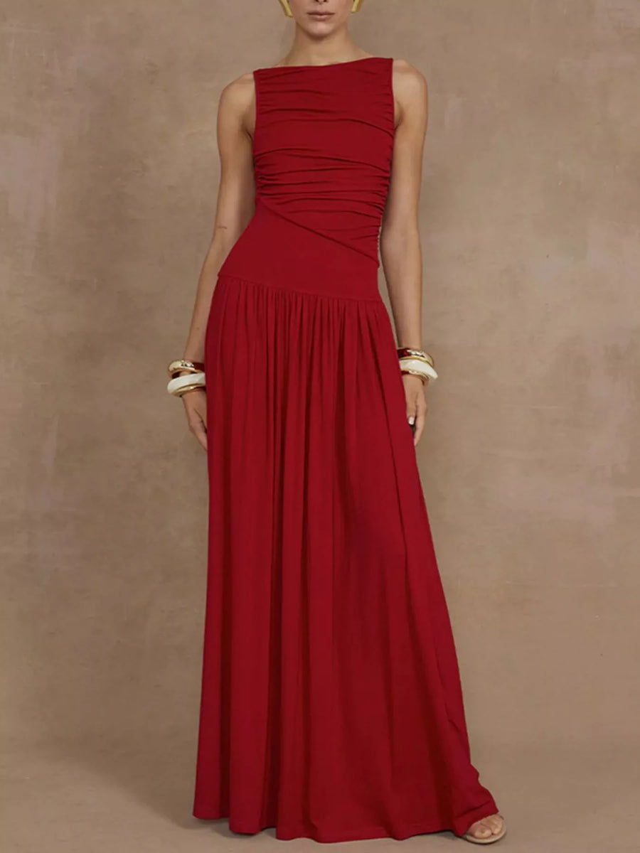 Red evening gown on a model against a beige background