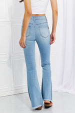 Woman showing back of Vibrant MIU Jess Flare Jeans | Ultra High Rise Button Fly Denim