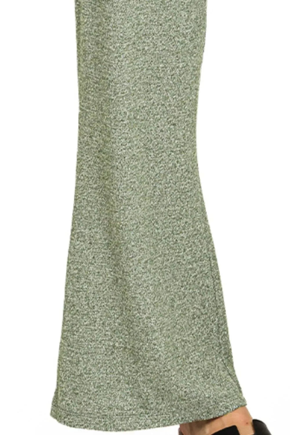 Green textured fabric on a white background