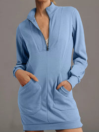 Light blue zip-up hoodie with pockets on a gray background