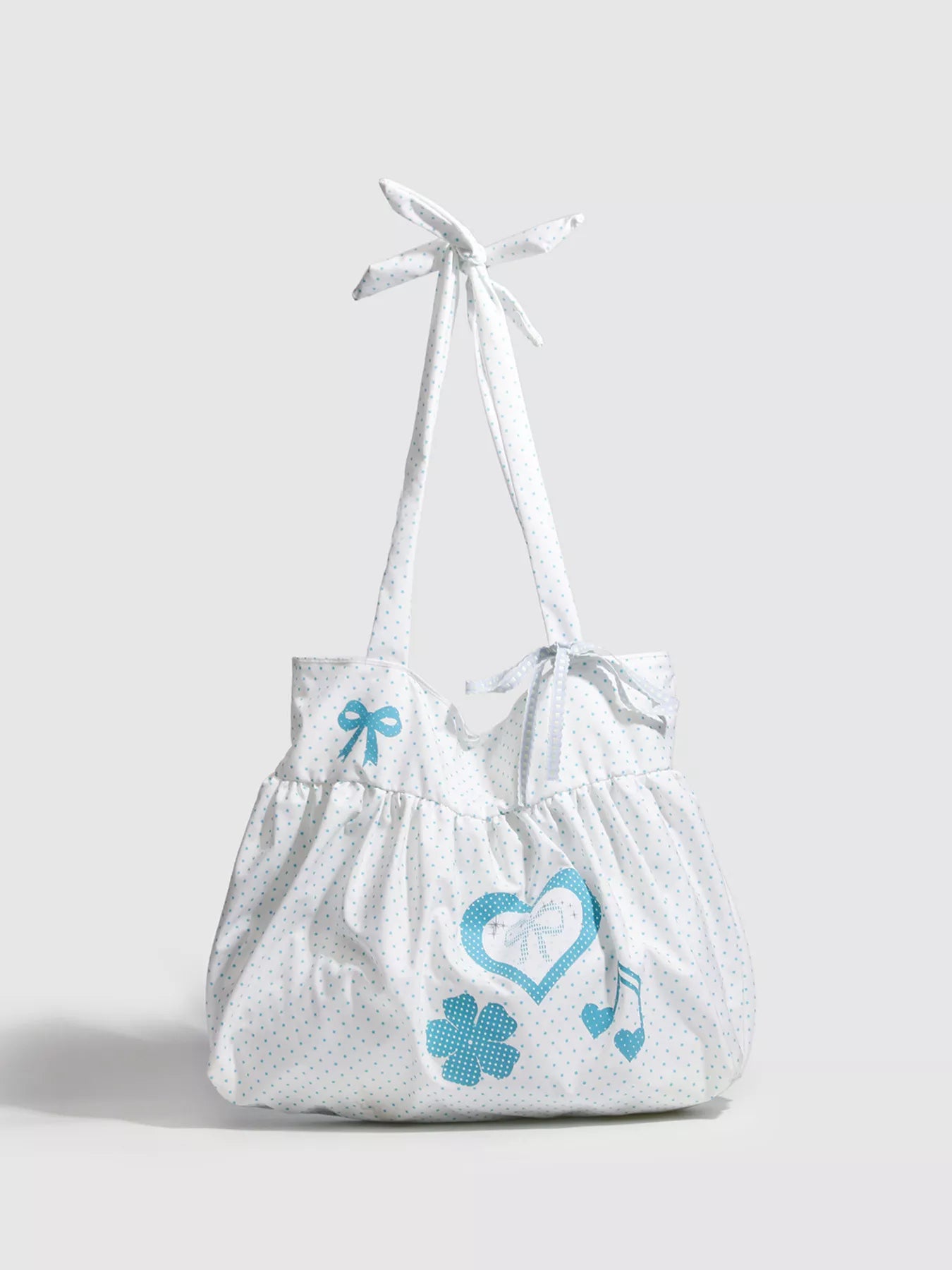 White bag with blue designs on a light gray background