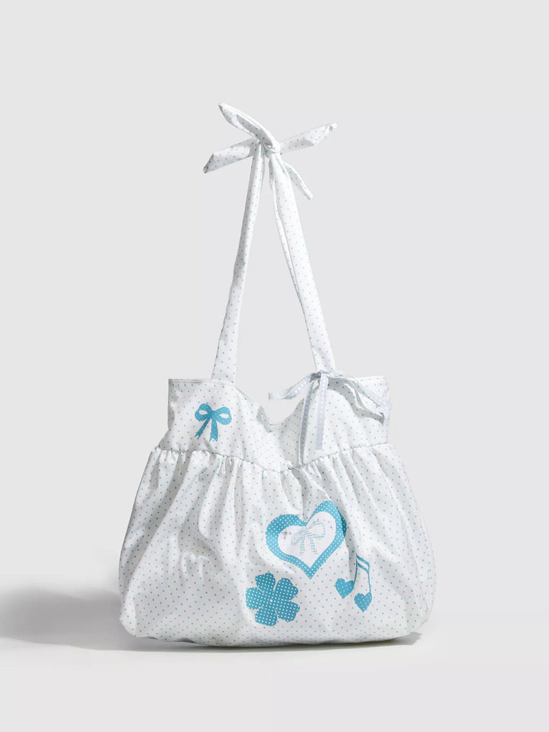 White bag with blue designs on a light gray background