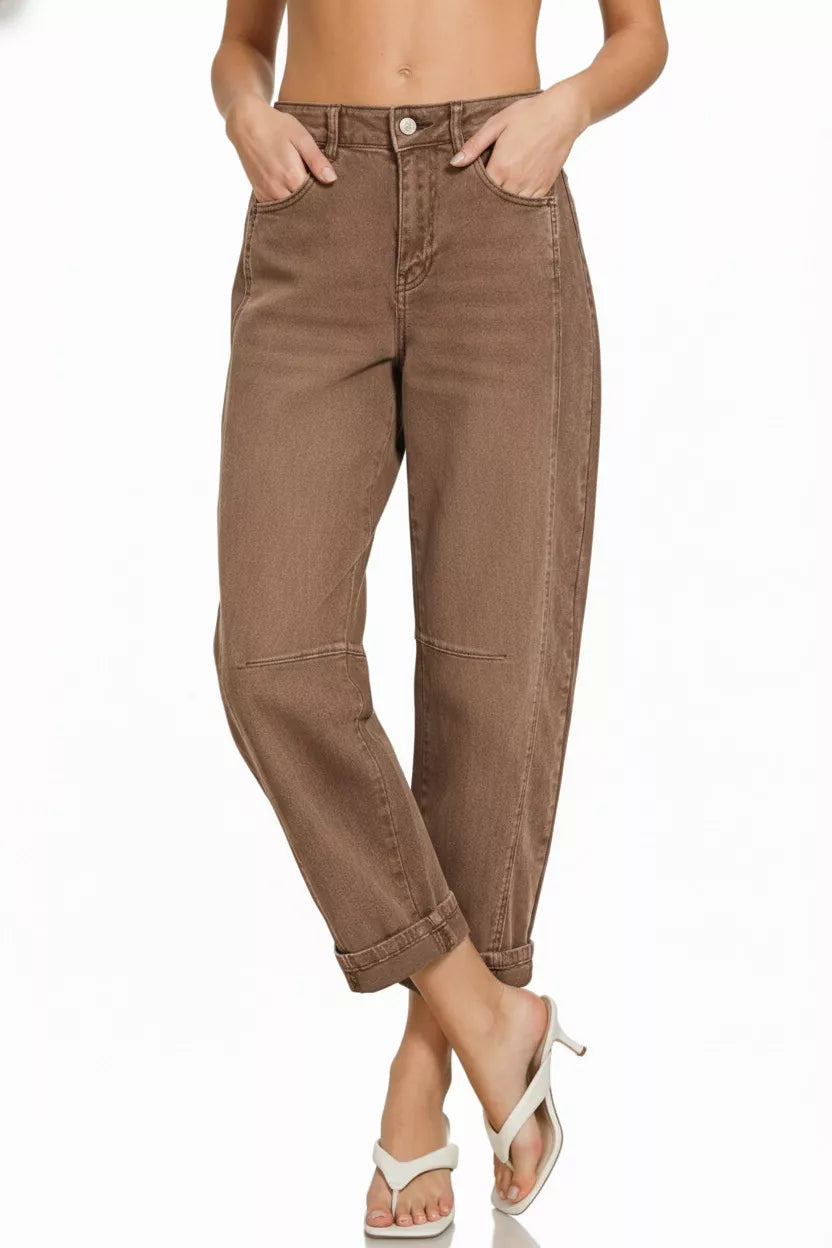 Brown pants worn by a person on a white background