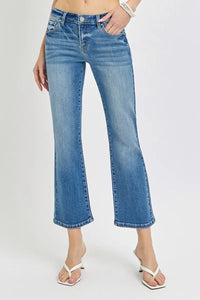Blue jeans worn by a person on a white background