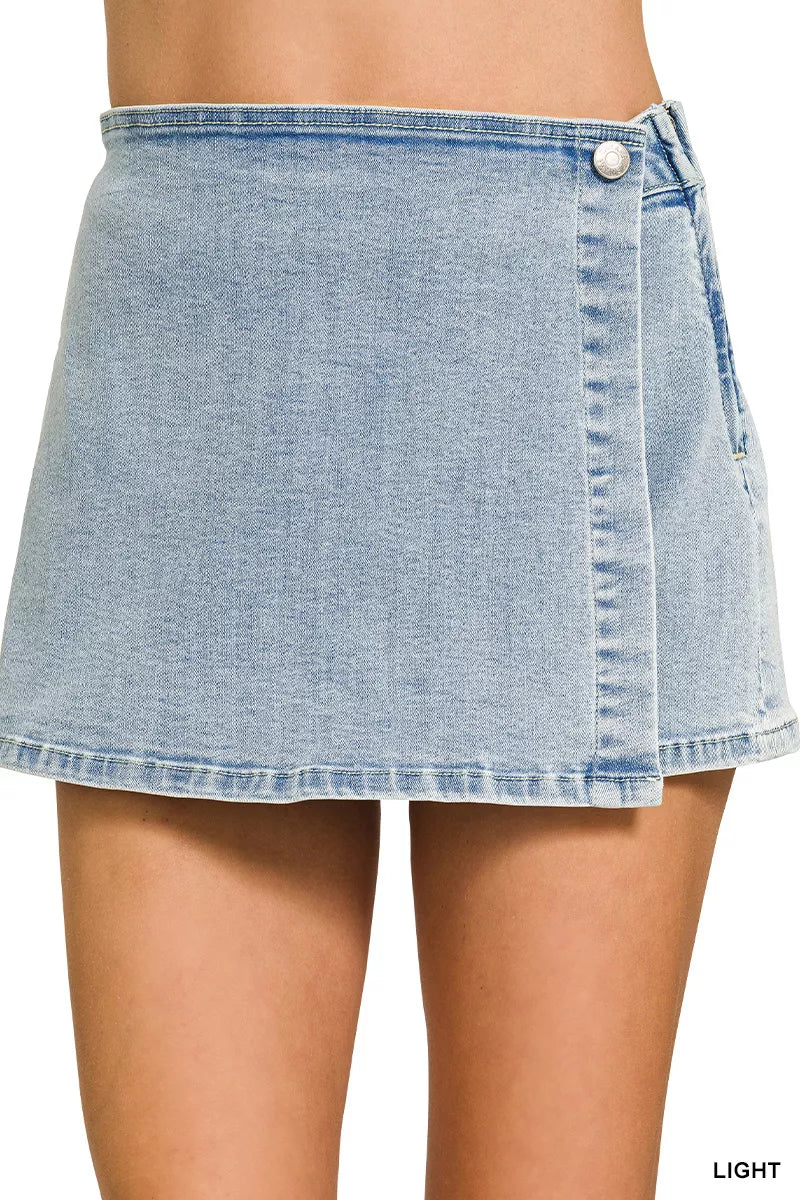 Light blue denim skirt worn by a person on a white background