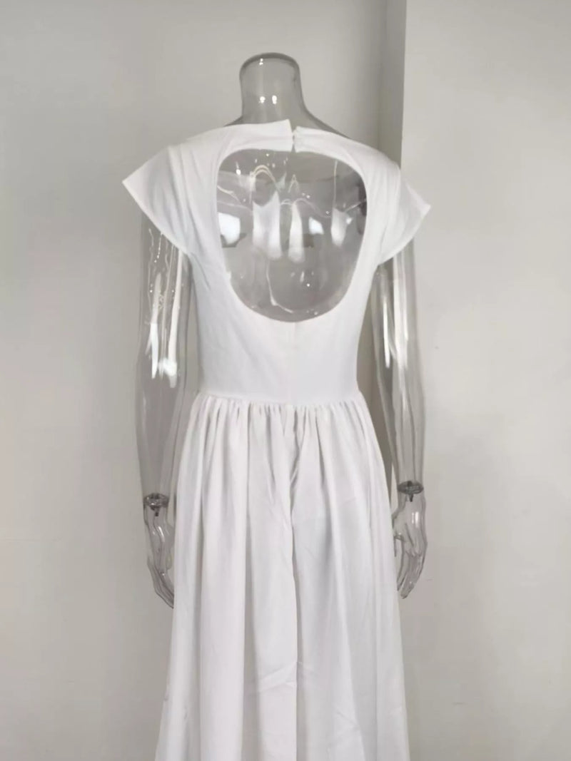 White dress with cut-out back on a mannequin against a plain background