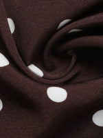 Brown fabric with white polka dots, close-up view
