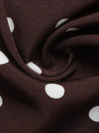 Brown fabric with white polka dots, close-up view