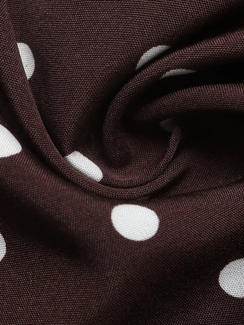 Brown fabric with white polka dots, close-up view