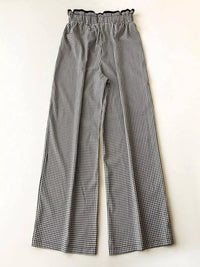 Black and white checkered pants on a white background