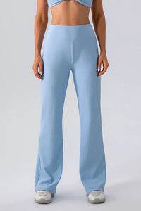 Light blue ribbed pants worn by a person on a light gray background