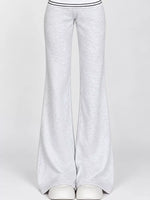 Light heather gray wide-leg sweatpants with a double stripe detail at the waistband, shown on a mannequin against a light gray background.