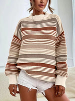 Person wearing a striped sweater and white shorts indoors