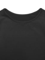 Close-up of a black shirt with a plain background