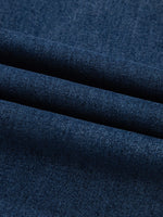 Close-up of dark blue fabric with a textured pattern