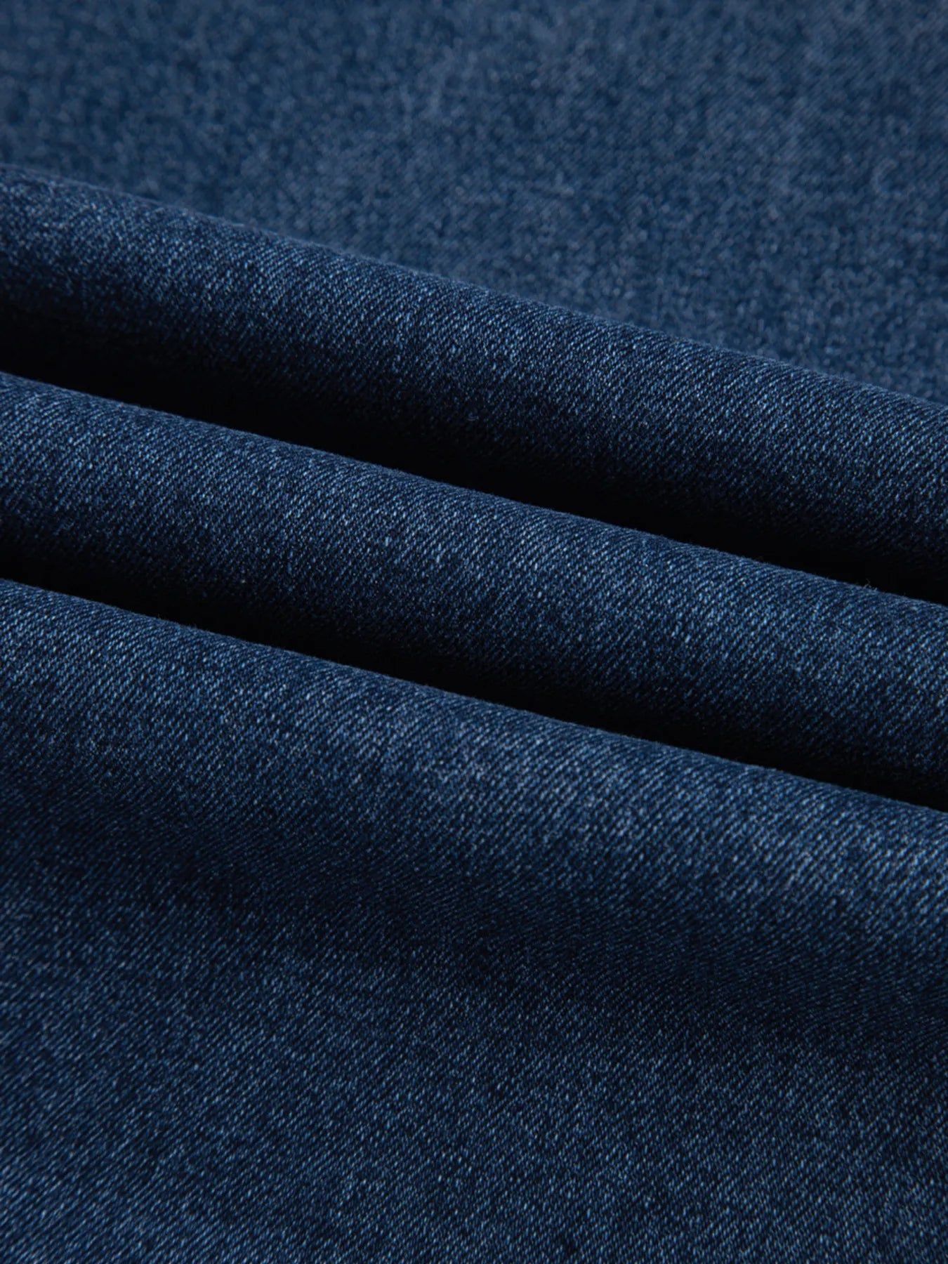 Close-up of dark blue fabric with a textured pattern