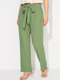 Green pants with a tie waist on a white background
