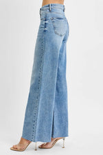 Light blue wide-leg jeans on a white background