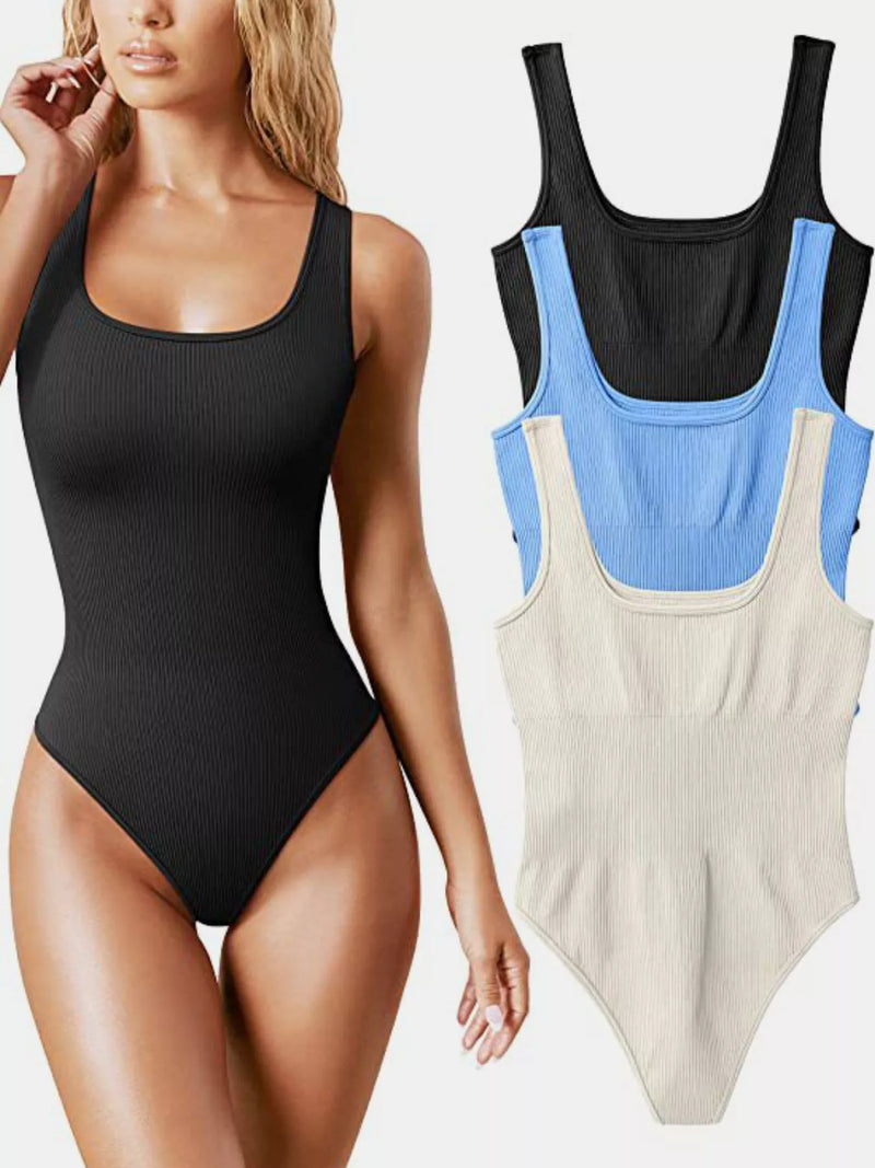 A woman models a black ribbed one-piece bodysuit on the left, while three additional color variants are shown on the right: black, light blue, and cream. The background is a clean white studio backdrop.